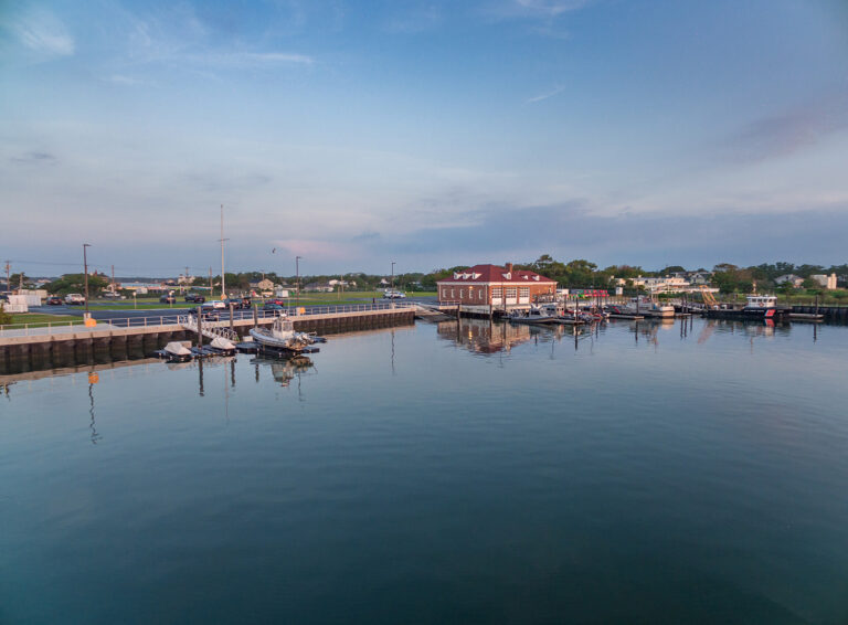 Aerial of a waterfront marina and harbor district