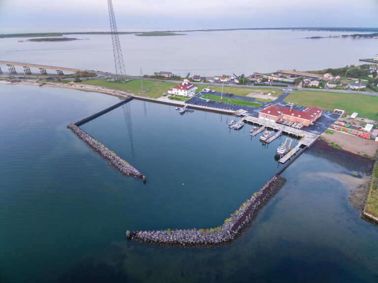Aerial record of breakwater construction at a waterfront site