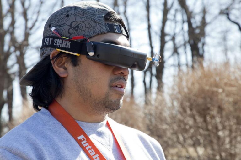 Drone pilot flying with FPV goggles during a flight session