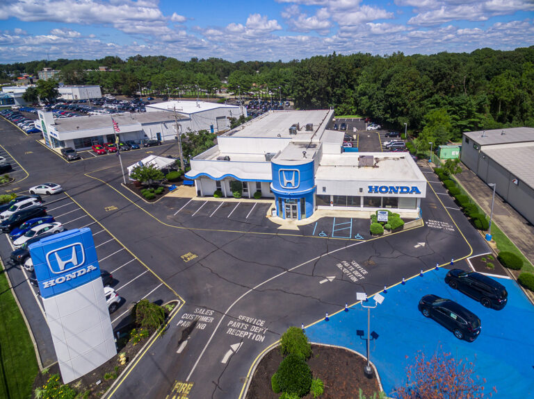 Overhead drone view of a dealership lot, lane markings and road access in Toms River, NJ