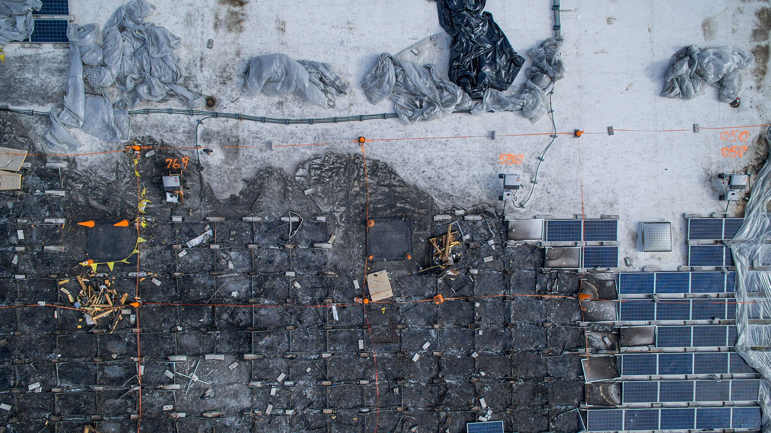 Drone roof inspection photo showing solar racking and panel condition