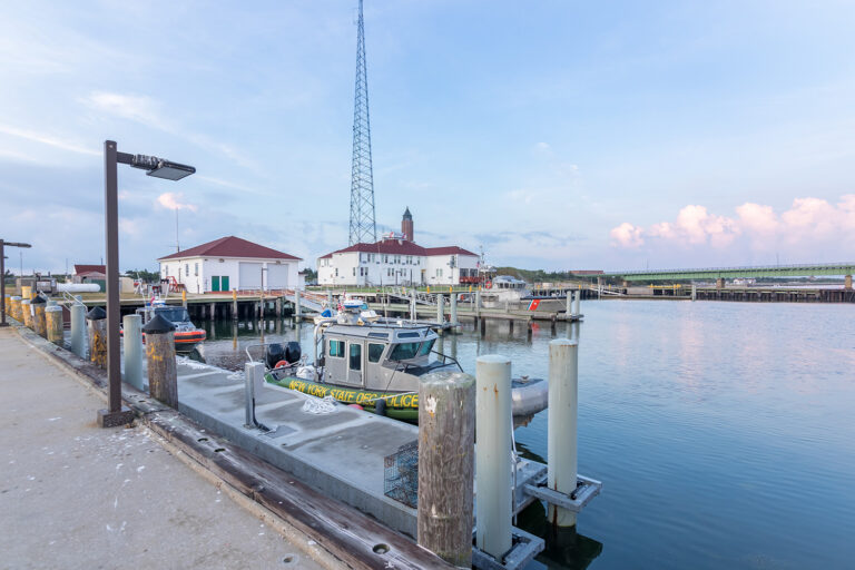 Drone view of a waterfront pier and harbor building