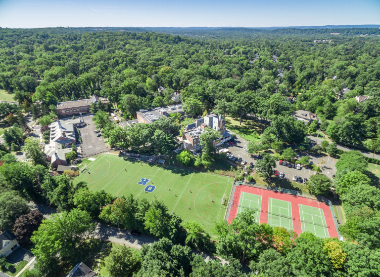 Aerial drone view over manicured green grounds, Summit, NJ