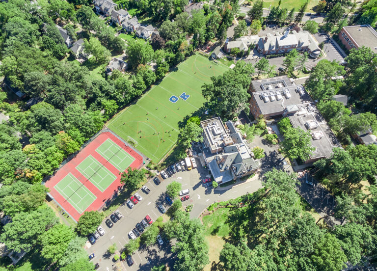 Drone photo of tree-lined fairway-style grounds, Summit, NJ