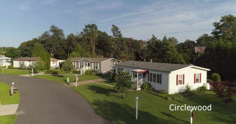 Wide aerial view of a manufactured home community captured by drone
