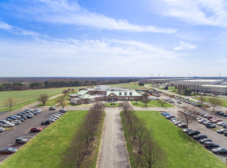 Drone photo of parking lots and a tree-lined entry walkway in Westampton, NJ