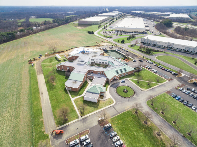 Wide aerial of a Westampton, NJ campus showing buildings, parking lots and roads