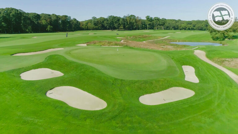 Wide drone panorama down a fairway at St. George’s Golf & Country Club, NY
