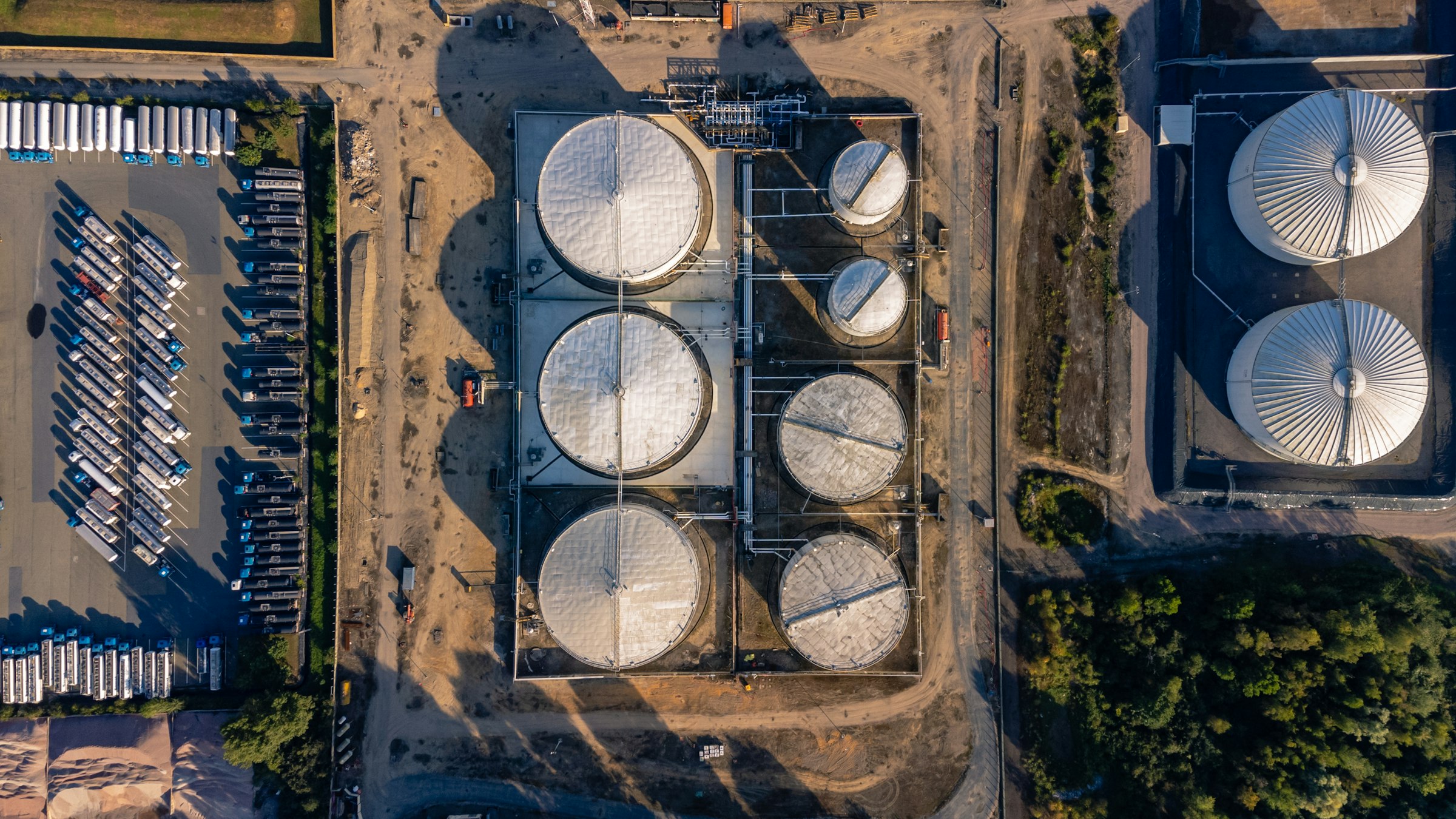 Top-down drone view of a tank farm and industrial storage terminal