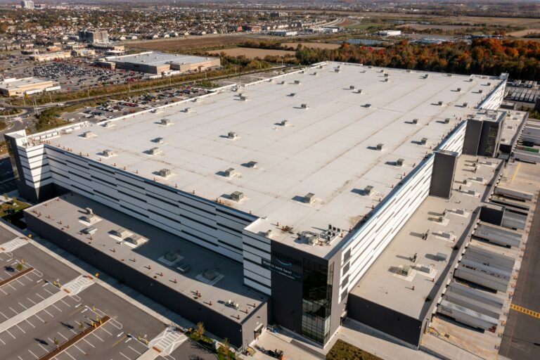 Aerial view of a large commercial warehouse roof