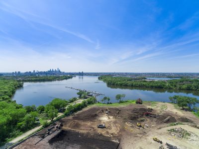Drone view over the Camden, NJ riverfront with a city skyline on the horizon